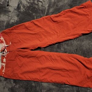 Pantagonia Loooooong Board Shorts. Orange Drawstring Pants with Floral Detail.